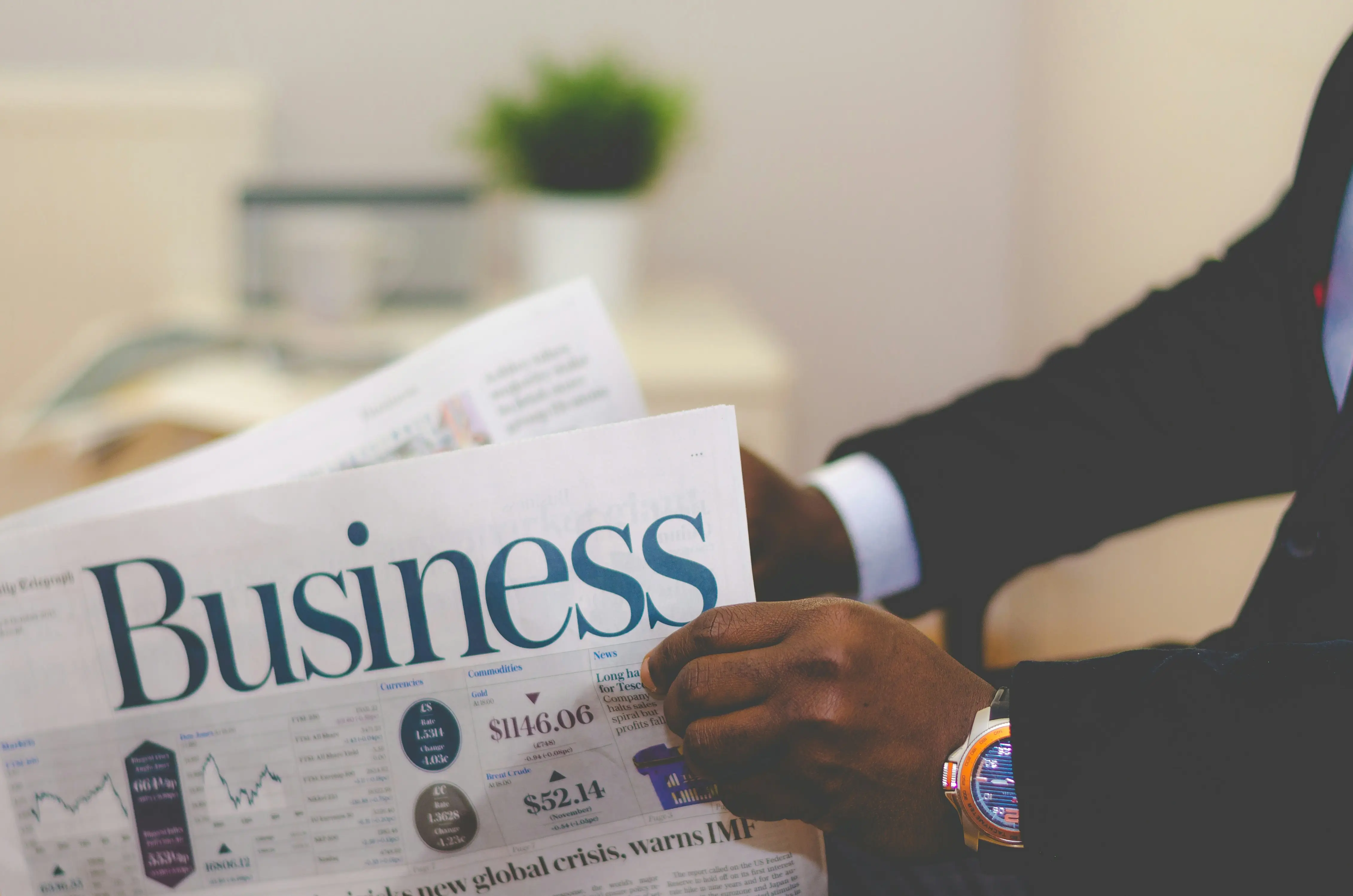 A business newspaper spread open on a desk